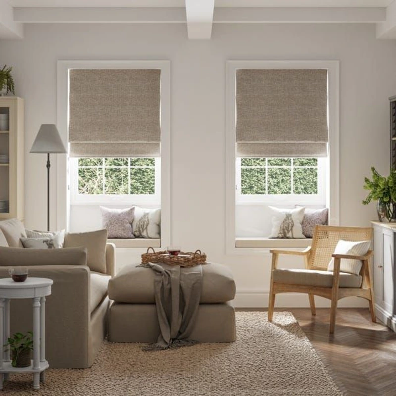 Beige Roman shades in a cozy neutral living room