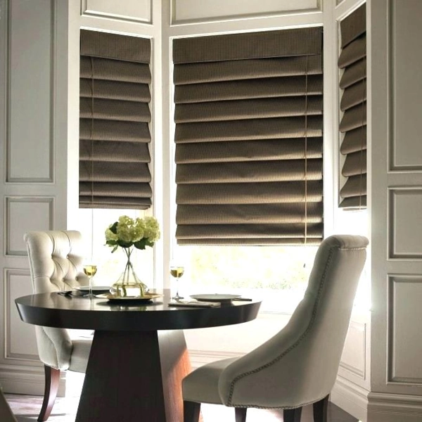 Elegant cascading fabric Looped Roman Blinds in a soft neutral room