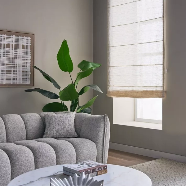 Light-filtering white sheer blinds in a bright space