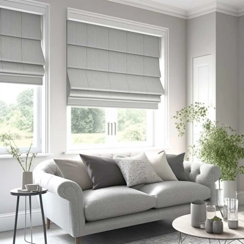 Light grey Roman shades in a soft, modern living space