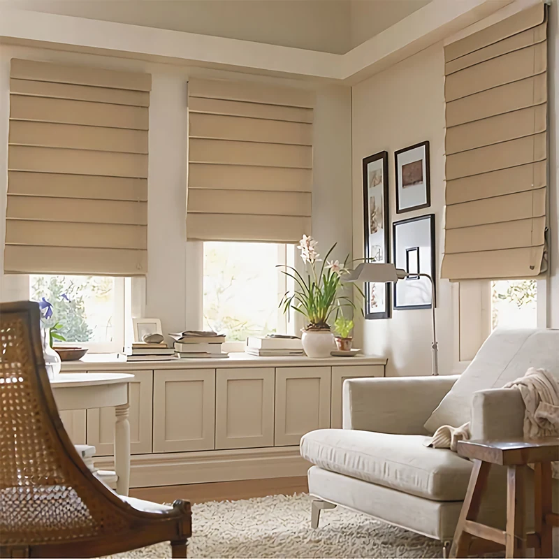 Tan Roman shades in a bright, elegant sitting room